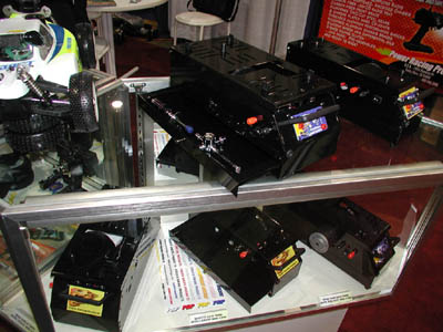 Also at their booth was a full line of nitro starter boxes for 1/8th and 1/10th scale vehicles.  Each box has a lower drawer on it for tool storage, and accepts either twin 7.2V packs or a single 12V battery for operation.  There is also a high-torque version of the 1/10th box available. (Click to enlarge)