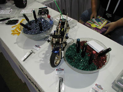 The RC Screws booth at the show, complete with buckets of red, blue and green screws to sample from.  Each screw kit from RC Screws comes in one of the small oganizer boxes that are visible around the table. (Click to enlarge)