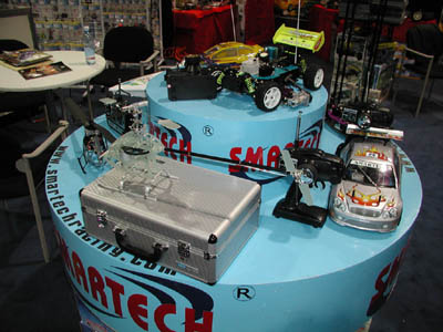 Some of the many vehicles and models being shown off in the Smartech booth.  With many, many different ready-to-run kits available, the company is a hobbyist's dream come true. (Click to enlarge)