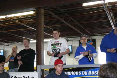 On the stand before a 19T A-Main are Bobby Flack, Paul Lemieux and Timmy Heiser. (Click to enlarge)